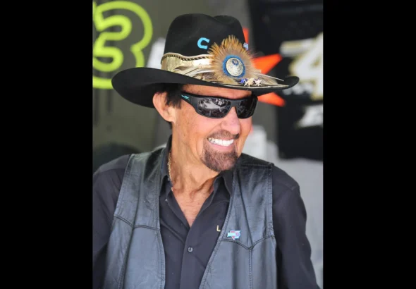 Richard Petty in his signature cowboy hat and sunglasses