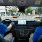 Seattle CARE Community Crisis Responders driving south on Third Avenue in a CCR vehicle