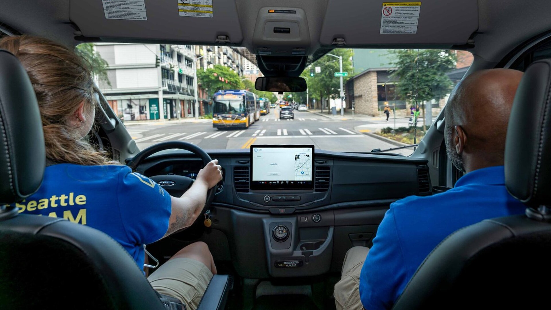 Seattle CARE Community Crisis Responders driving south on Third Avenue in a CCR vehicle