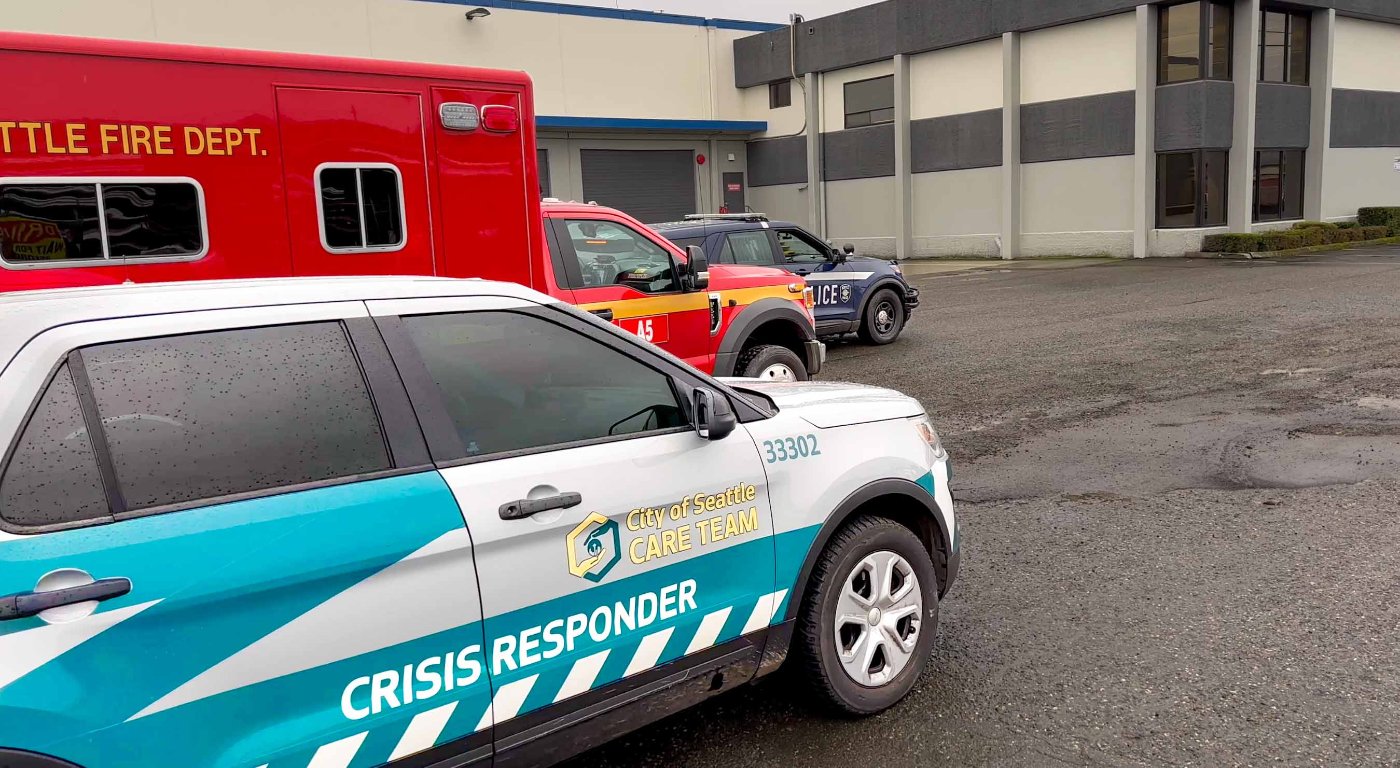 Three Seattle responder vehicles from CARE, the fire department and police lined up one after another