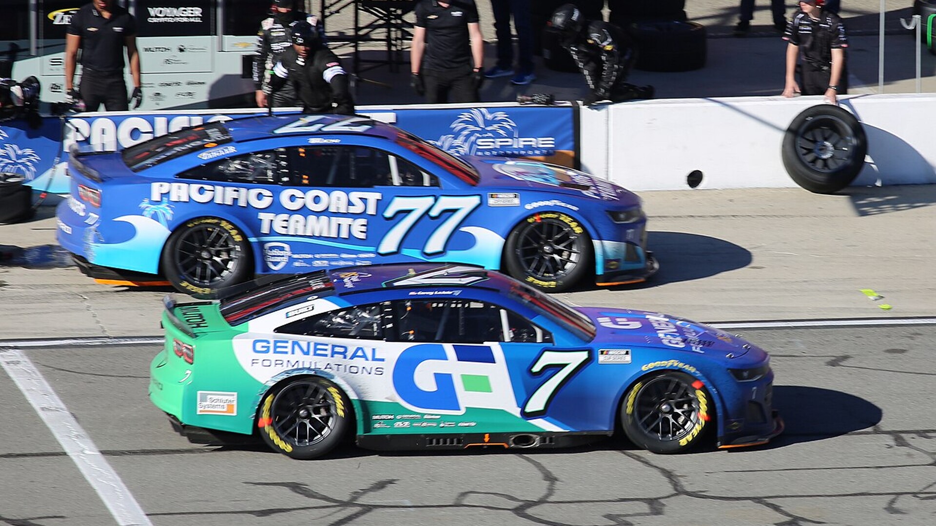 Spire Motorsports Cup Series cars on pit road at Auto Club Speedway