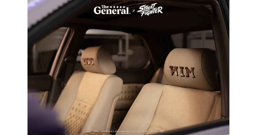 Tan leather seats with pixel-font You and Win stitched into the headrests