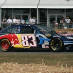 A race car laying down tire smoke during a burnout