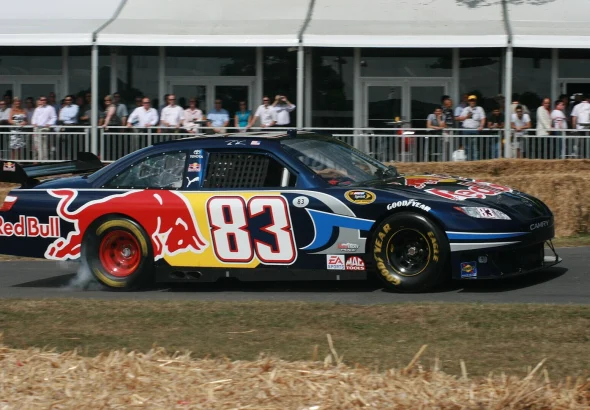 A race car laying down tire smoke during a burnout