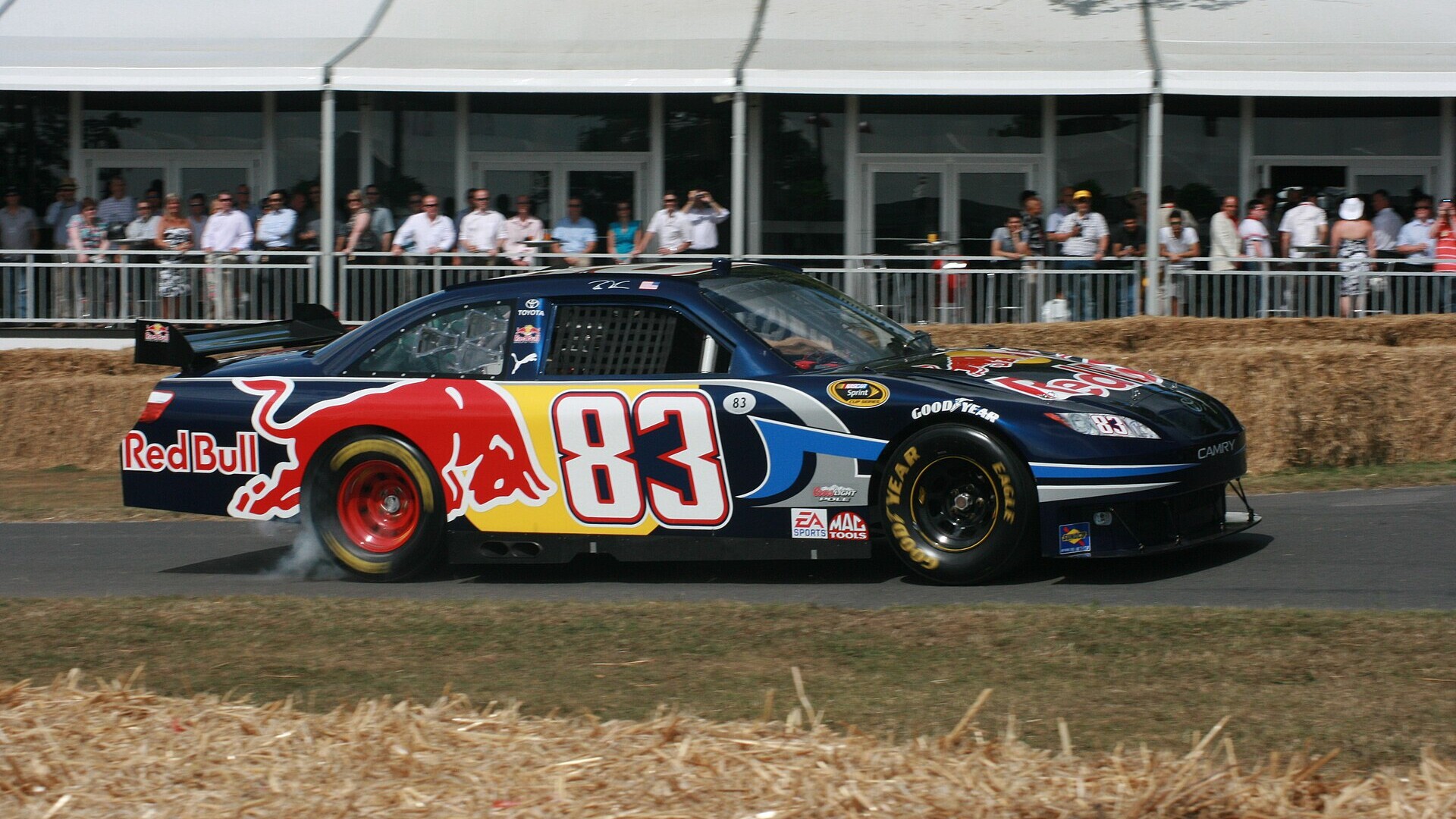 A race car laying down tire smoke during a burnout