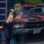 Photo illustration blending a Taylor Swift concert photo with a red 1970 Chevrolet Chevelle SS