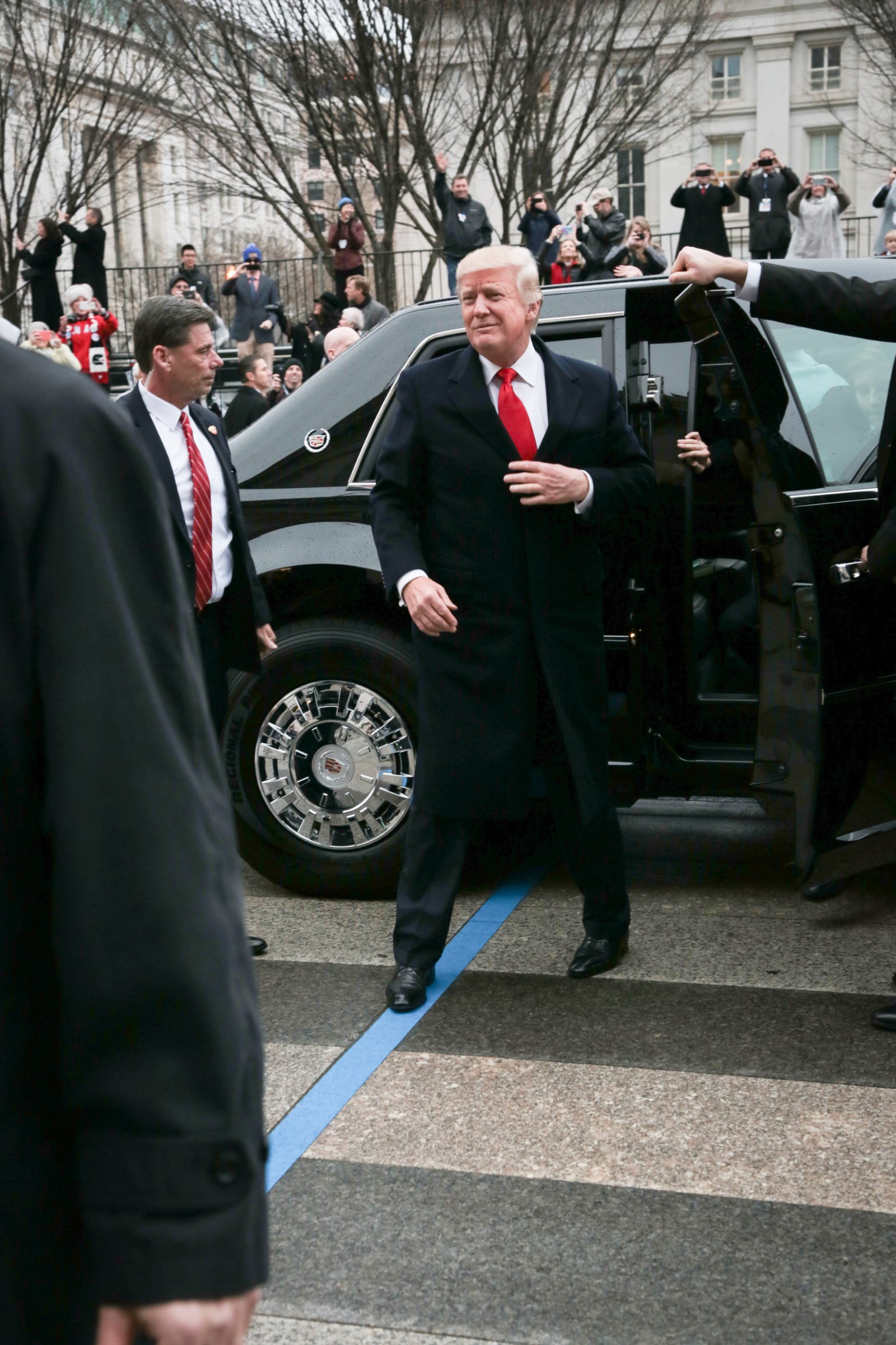 Donald Trump stepping out of the presidential limousine during the 2017 inaugural parade