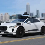 A driverless Waymo Jaguar I-Pace robotaxi on a San Francisco street