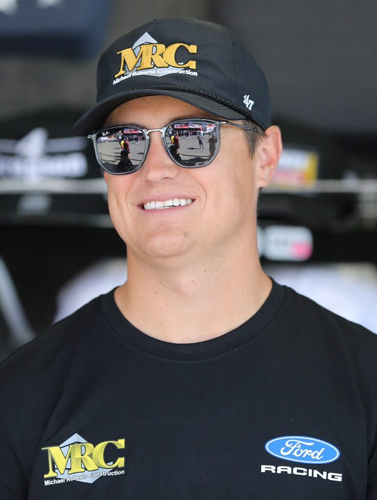 Zane Smith in sunglasses and a black cap at Sonoma Raceway